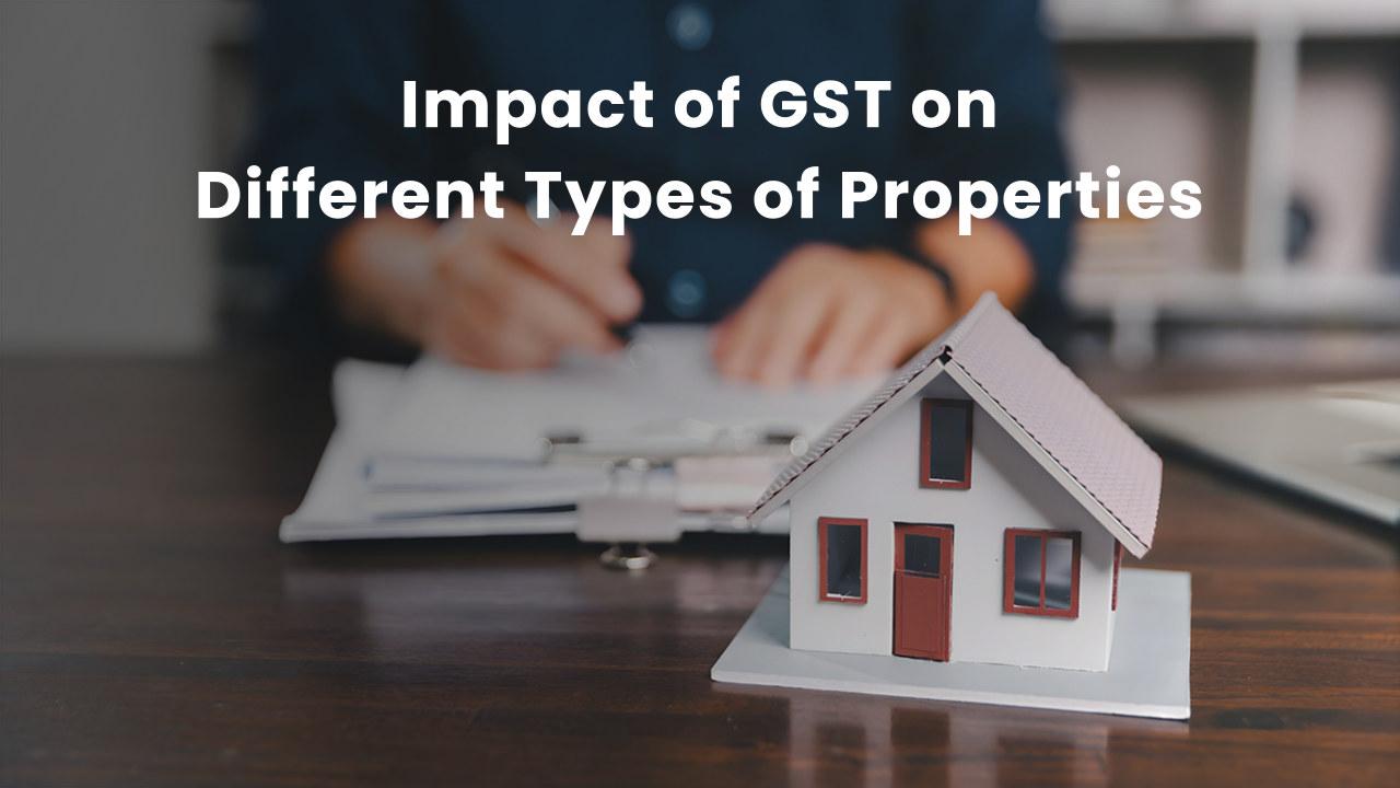 Miniature house model placed on a table with a person reviewing property documents in the background, illustrating GST 2.0’s varying impact on under-construction, commercial, and ready-to-move properties in 2025.