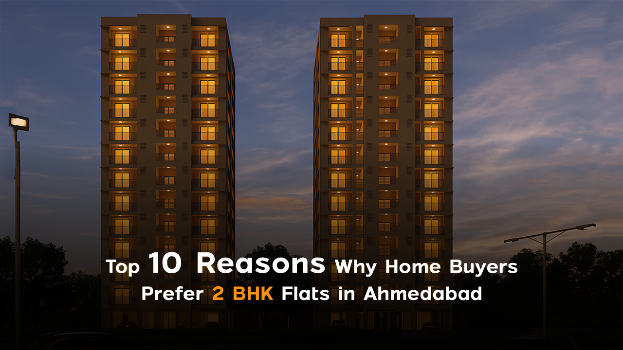 Two illuminated residential towers at dusk in Ahmedabad, representing the growing demand for 2 BHK flats due to affordability, practicality, and strong resale value in the city’s evolving real estate market.