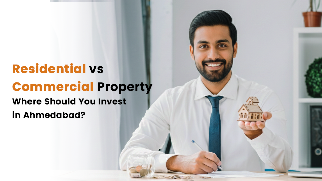 Smiling man in formal attire holding a miniature house model, seated at a desk with coins and documents, alongside the text “Residential vs Commercial Property – Where Should You Invest in Ahmedabad?”, representing real estate investment decisions in 2026.
