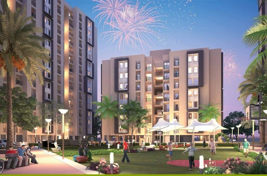 2 BHK flats in Narol Ahmedabad at Laxmi Nivas featuring landscaped garden, modern residential buildings, community seating, and well-lit surroundings with ready to move homes