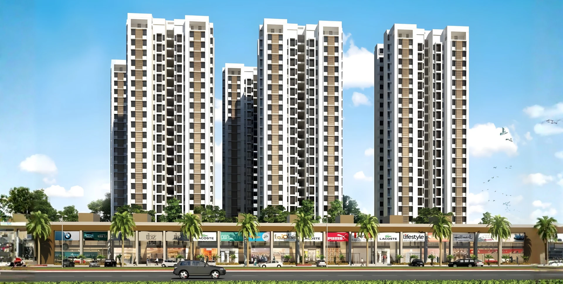 Exterior view of Laxmi SkyCity residential project offering spacious 3 and 4 BHK flats in Naroda, Ahmedabad, with modern architecture, commercial spaces, and lush greenery. Ideal for families seeking comfort and connectivity.