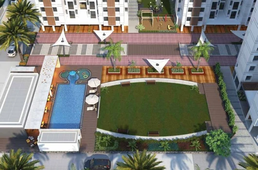 Aerial view of the Laxmi SkyCity residential flats in Naroda, Ahmedabad, featuring a swimming pool, spacious green area, and play zone, providing a relaxing environment for residents. Ideal for families seeking comfort and modern living.