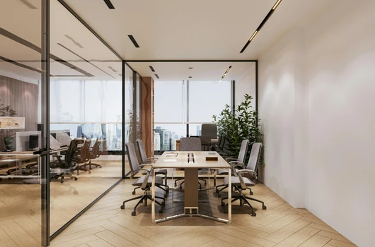 "Interior view of a modern commercial office space for sale in Ahmedabad with glass walls, a conference table, and stylish office furniture, offering a professional working environment."