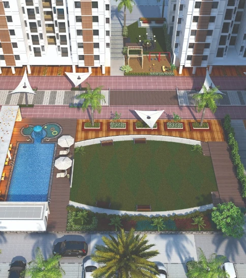 Top view of Laxmi Skycity flats in Nava Naroda, Ahmedabad featuring landscaped gardens, swimming pool with sun loungers, children’s play area, party lawn, and modern amenities; ideal for buyers searching for flats in Naroda Ahmedabad or new flat schemes in Naroda.